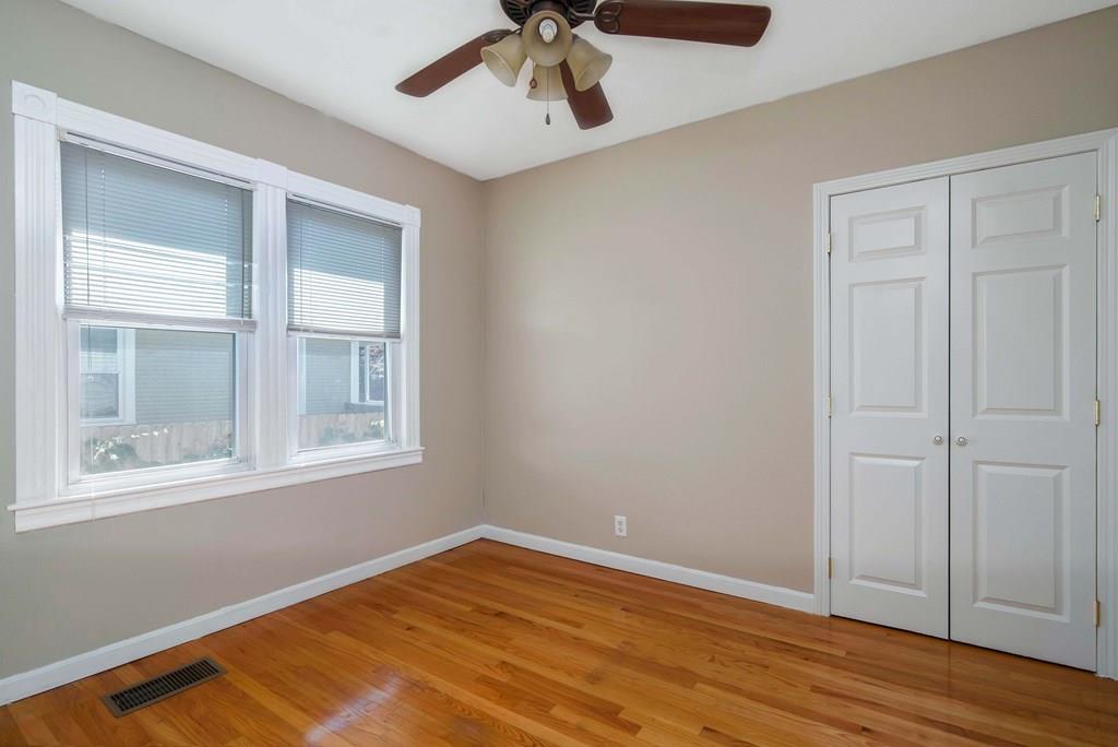 33 Goodwin Street Springfield, MA 01151 - Photo 14 of 27 a view of empty room with wooden floor and fan