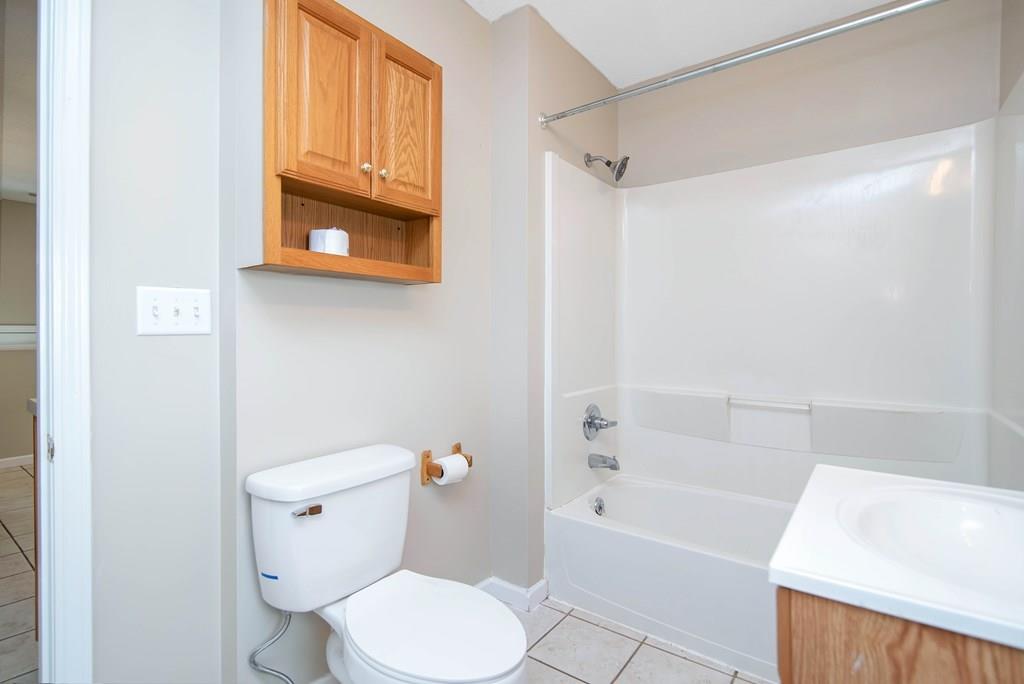 33 Goodwin Street Springfield, MA 01151 - Photo 17 of 27 a white toilet sitting next to a bath tub