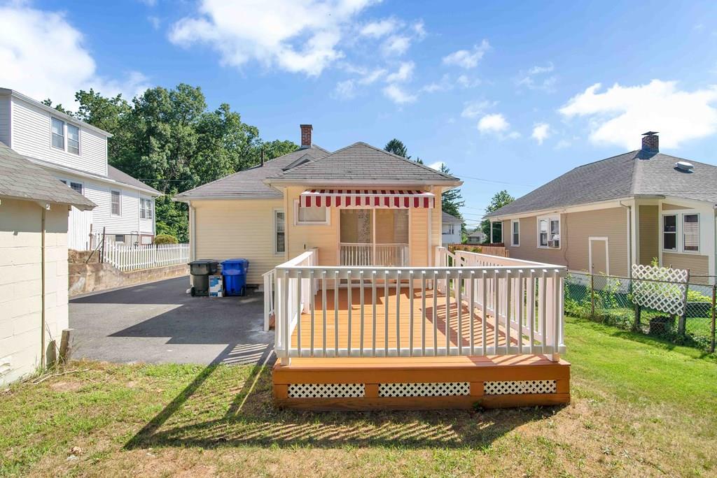 33 Goodwin Street Springfield, MA 01151 - Photo 2 of 27 a view of a house with a yard and deck