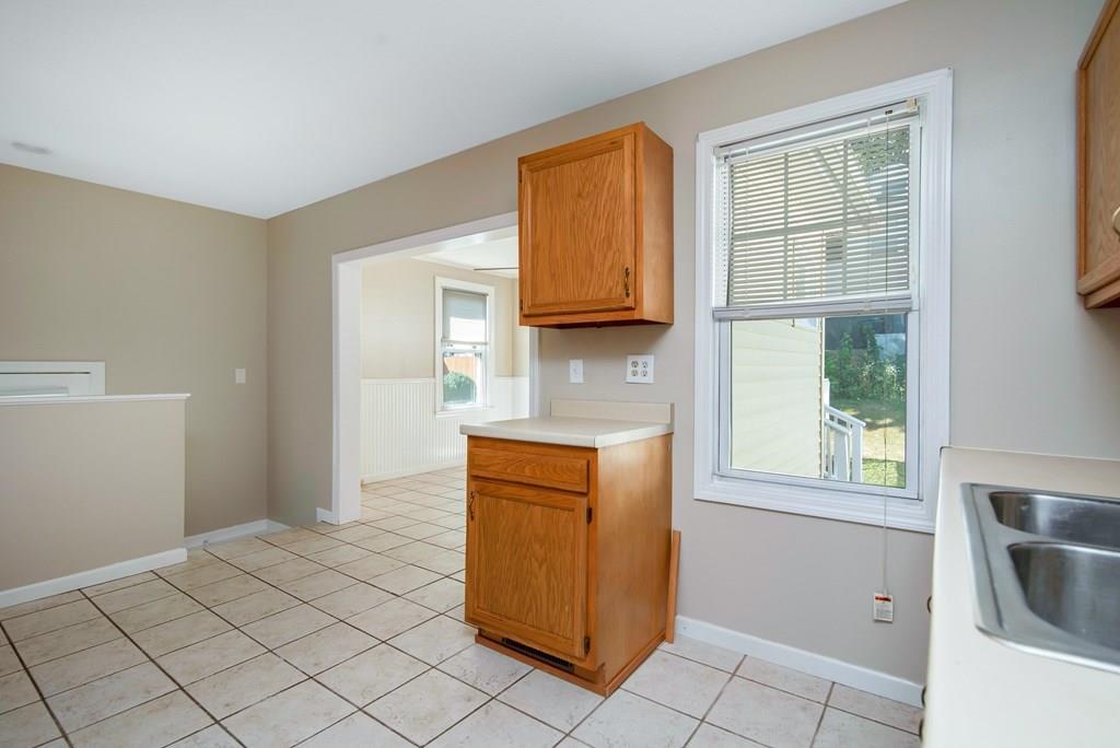 33 Goodwin Street Springfield, MA 01151 - Photo 8 of 27 a kitchen with granite countertop cabinets and window