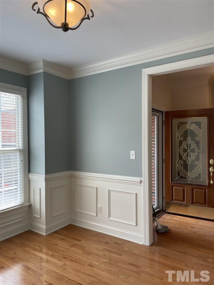 7370 Fontana Ridge Lane Raleigh, NC 27613 - Photo 16 of 27 an empty room with wooden floor and windows