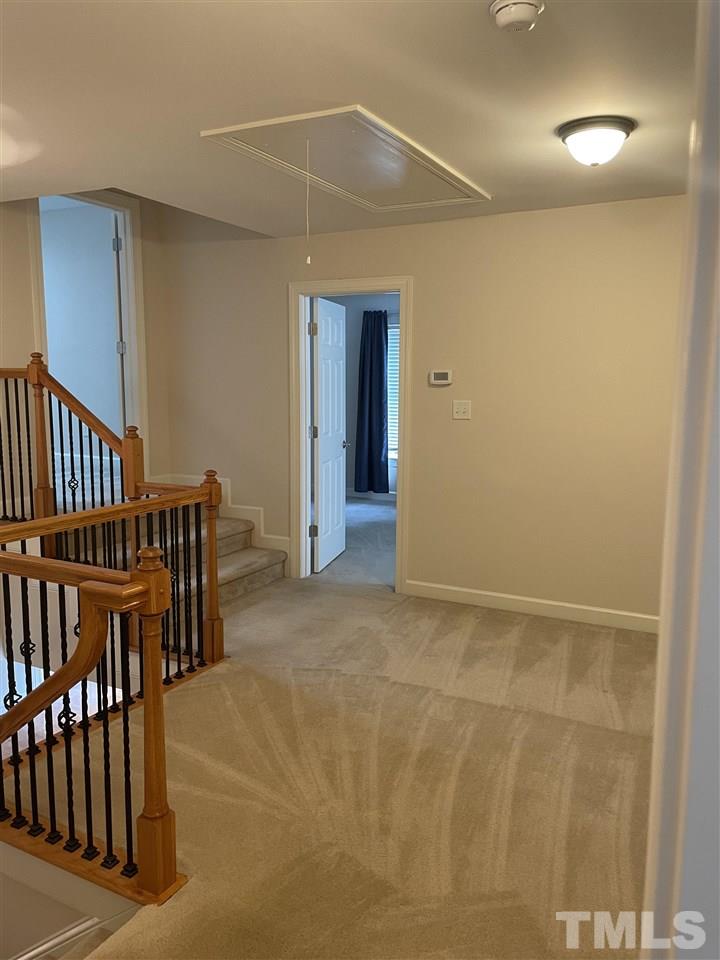 7370 Fontana Ridge Lane Raleigh, NC 27613 - Photo 24 of 27 a view of an empty room with wooden floor