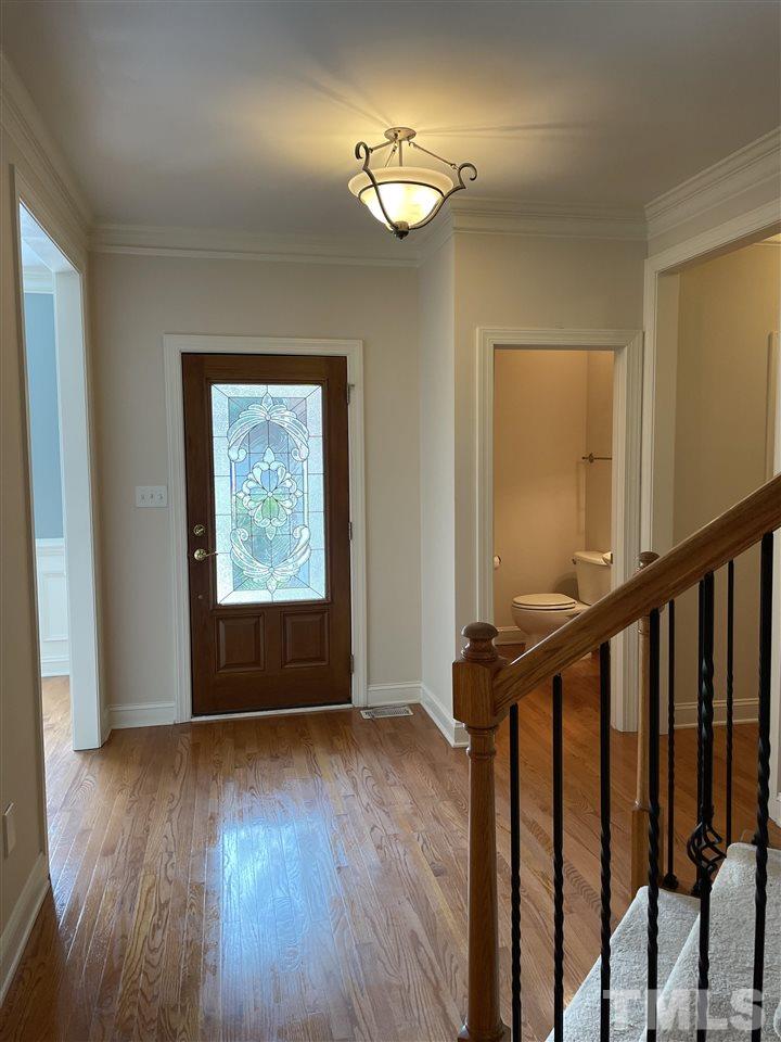 7370 Fontana Ridge Lane Raleigh, NC 27613 - Photo 25 of 27 a view of an empty room with wooden floor and fan