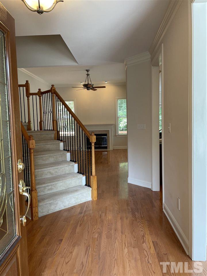 7370 Fontana Ridge Lane Raleigh, NC 27613 - Photo 4 of 27 a view of entryway and hall with wooden floor