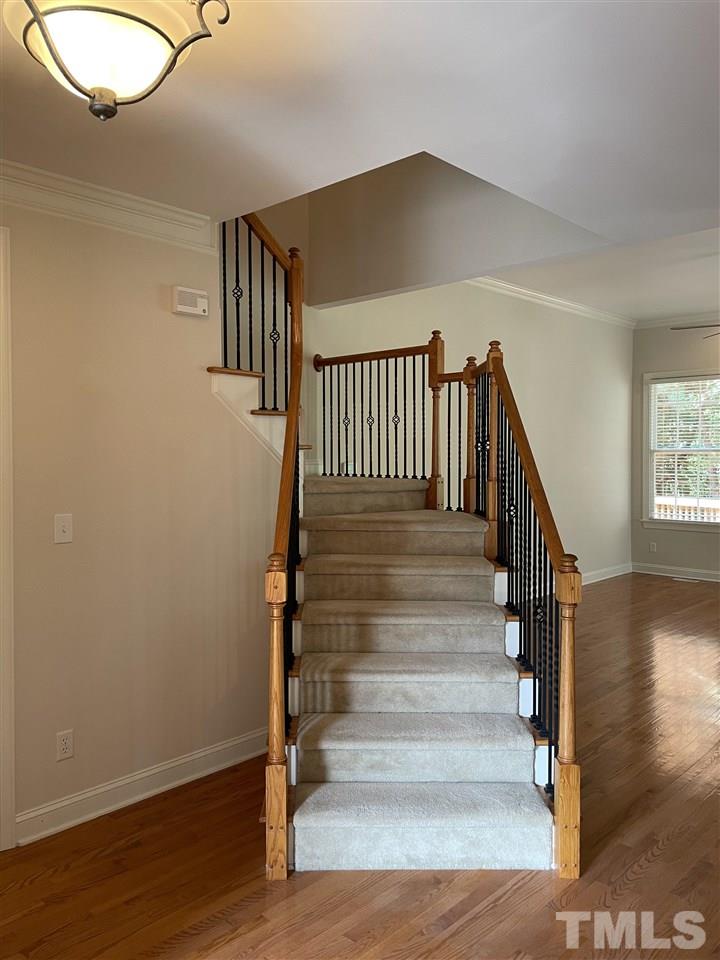 7370 Fontana Ridge Lane Raleigh, NC 27613 - Photo 5 of 27 a view of entryway and hall with wooden floor