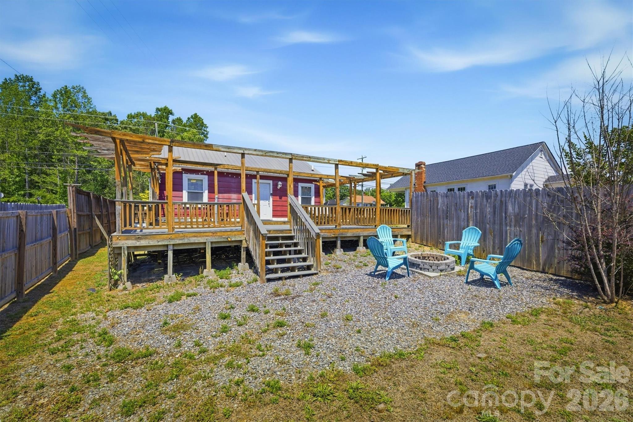 905 Carbon City Road Morganton, NC 28655 - Photo 4 of 29 a view of a chairs and table in a backyard