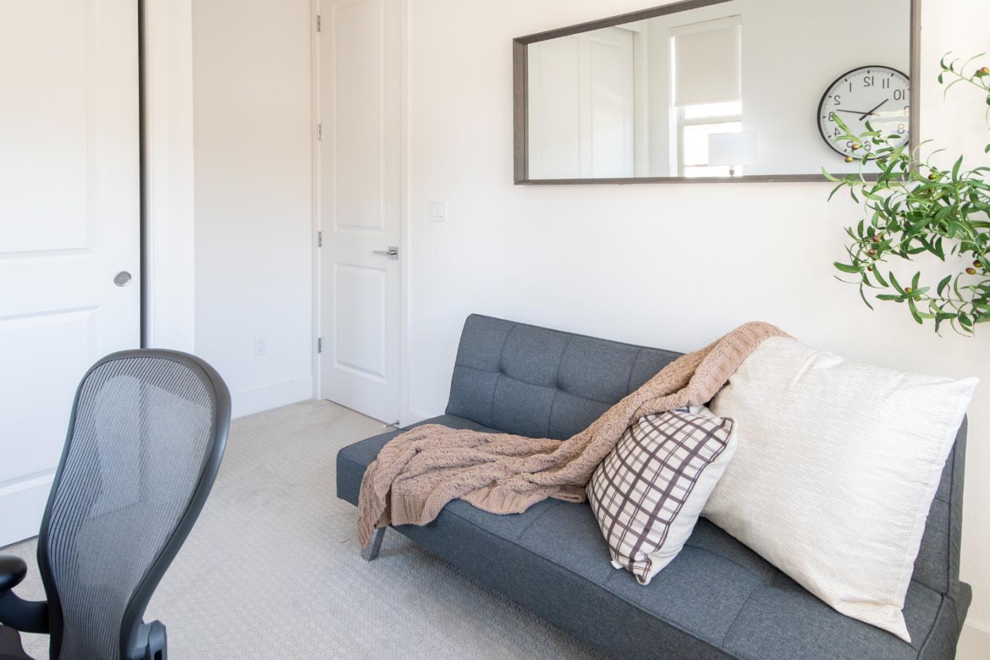 1291 Verano Road Mountain View, CA 94043 - Photo 21 of 49 a bedroom with a bed and a chandelier