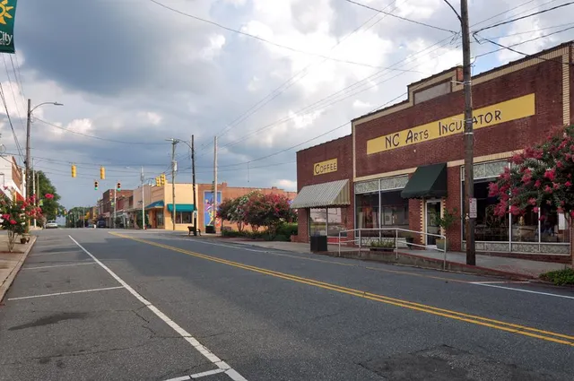 a view of a street with cars on the road