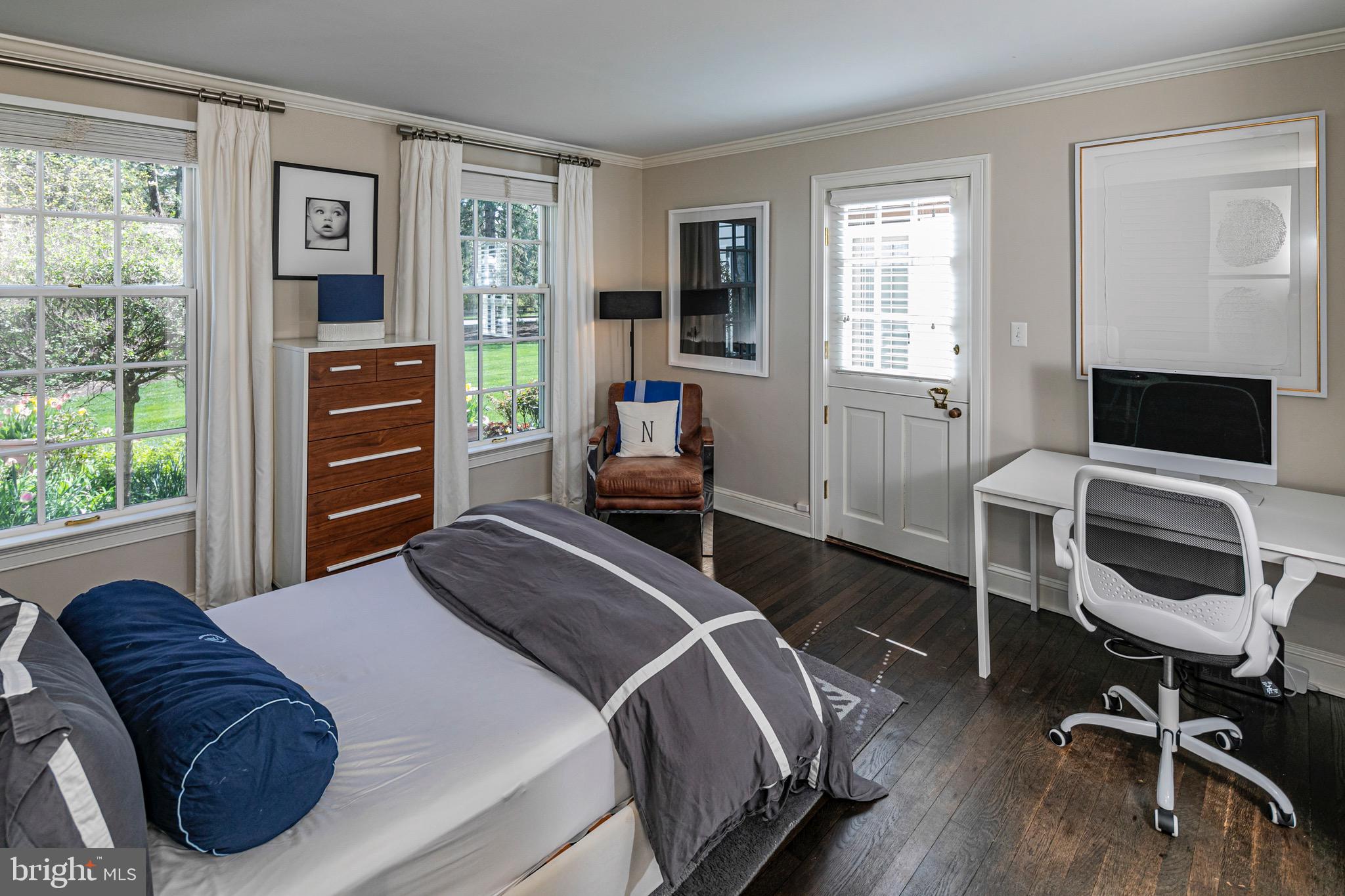 4445 Province Line Road Princeton, NJ 08540 - Photo 20 of 45 a bedroom with a bed and wooden floor