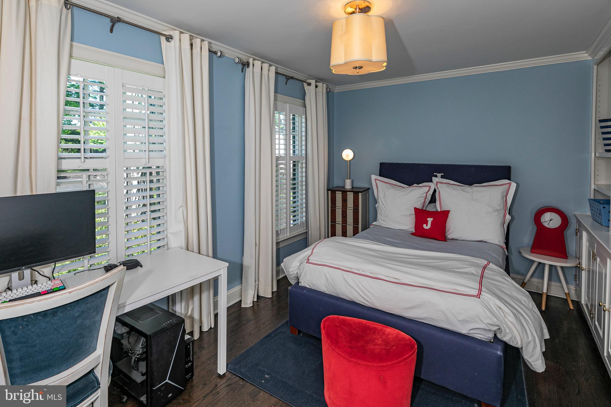 4445 Province Line Road Princeton, NJ 08540 - Photo 21 of 45 a bedroom with a bed and a flat screen tv