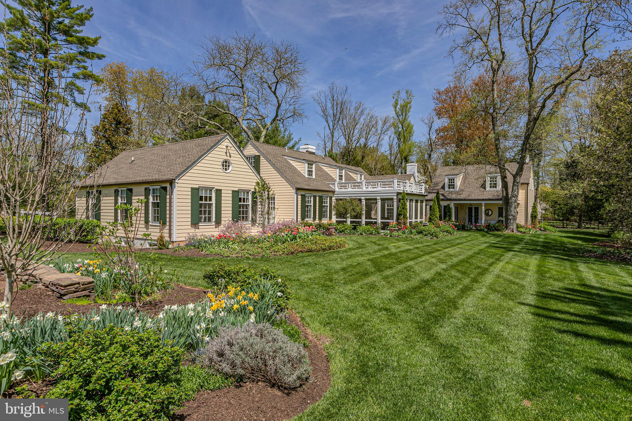 4445 Province Line Road Princeton, NJ 08540 - Photo 32 of 45 a front view of a house with a garden