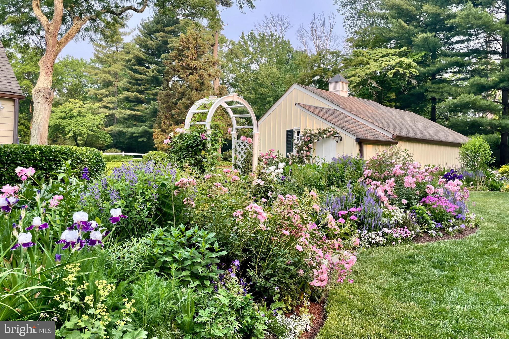 4445 Province Line Road Princeton, NJ 08540 - Photo 42 of 45 a view of a house with lots of flower and flowers
