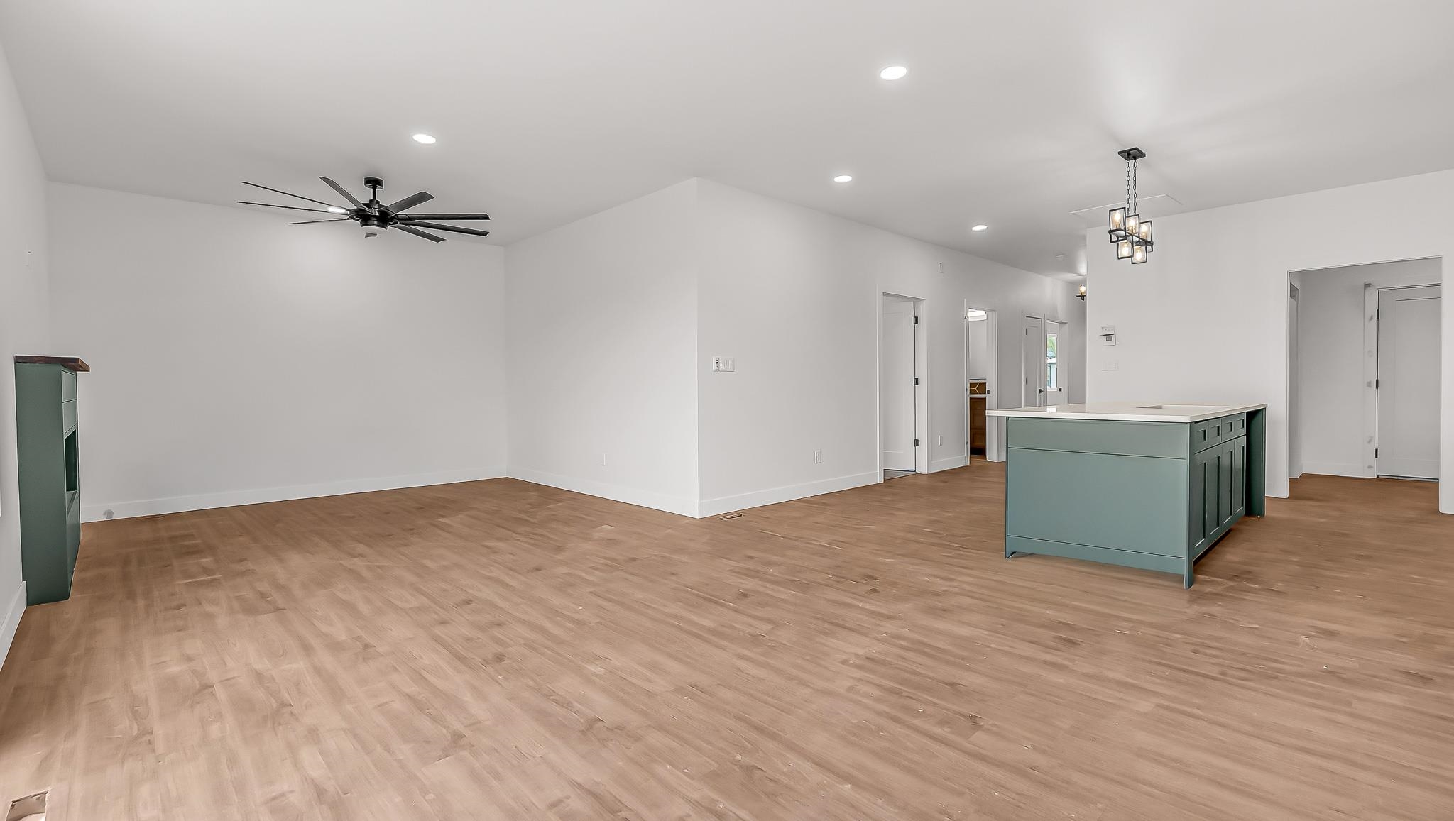 214 Limberpine Circle Parachute, CO 81635 - Photo 6 of 24 a view of a kitchen with a cabinet and a ceiling fan