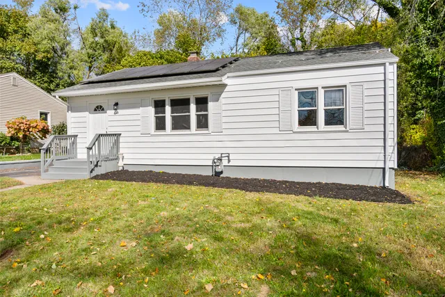 a front view of a house with a yard