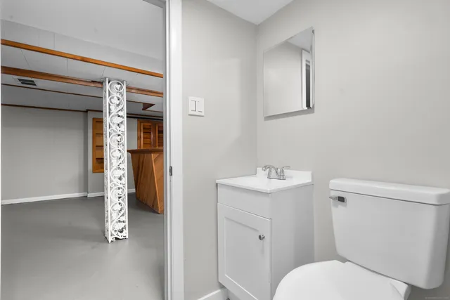 a bathroom with a toilet and shower