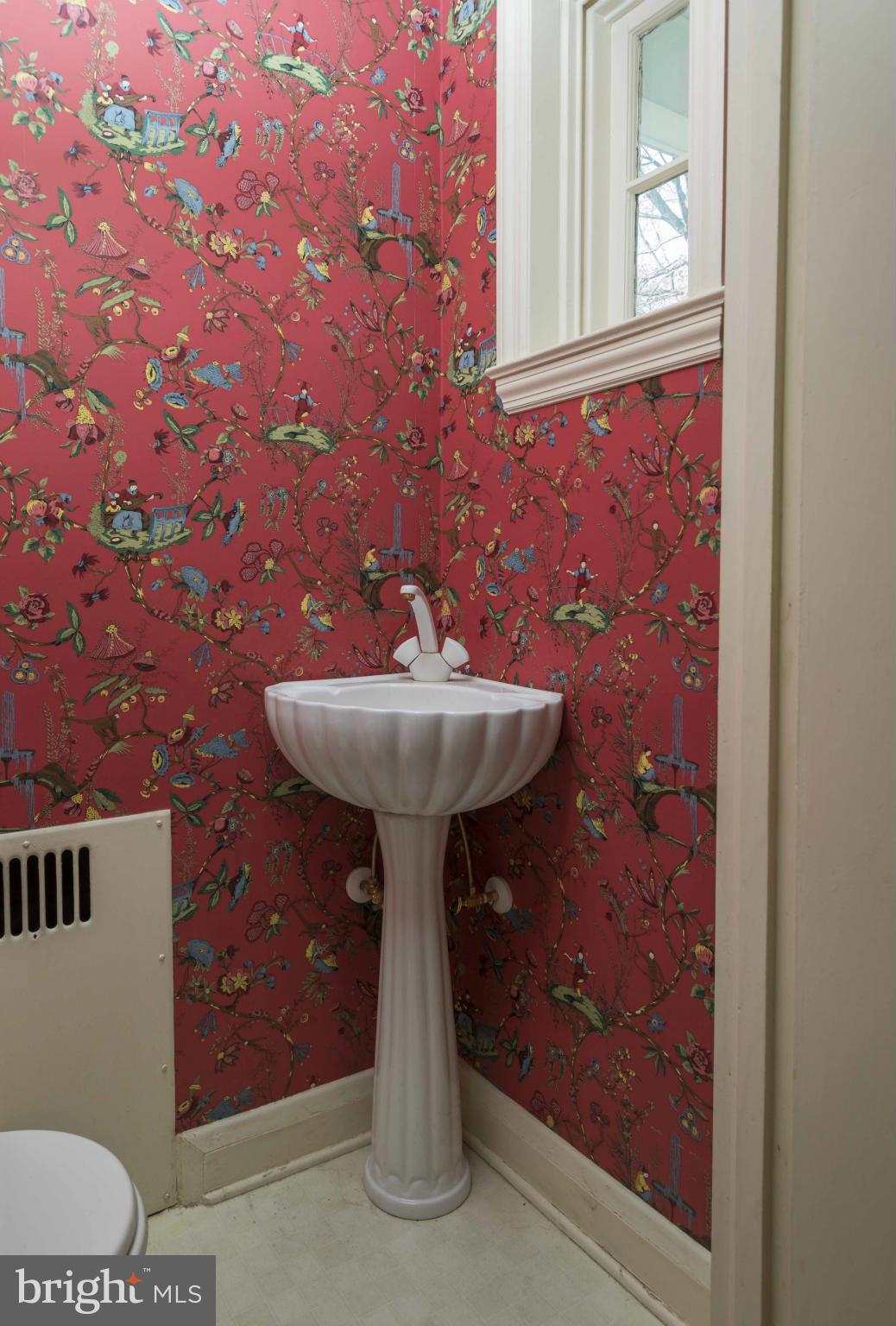208 Taplow Road Baltimore, MD 21212 - Photo 12 of 30 a bathroom with a sink and a mirror