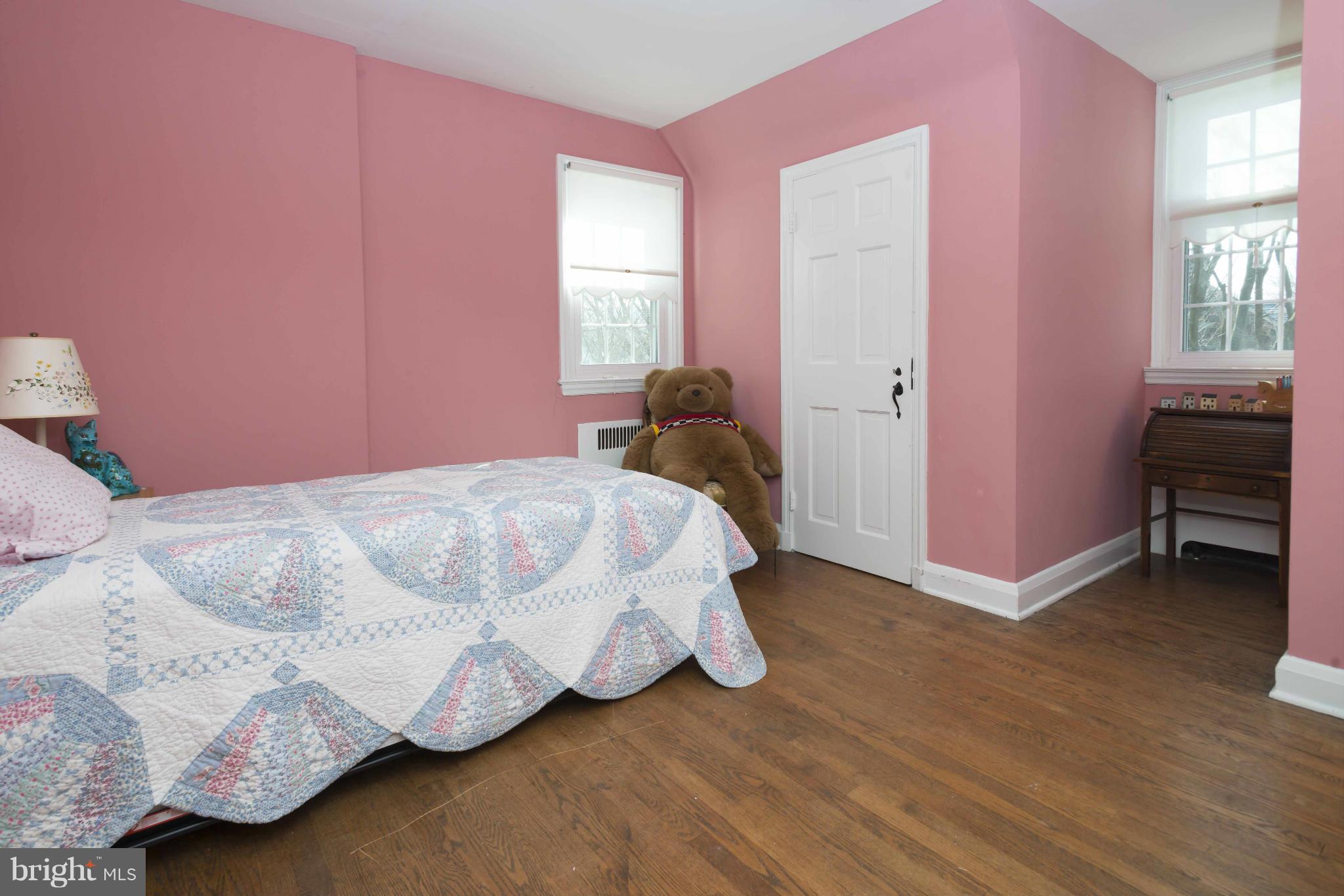208 Taplow Road Baltimore, MD 21212 - Photo 16 of 30 a bedroom with a bed and a window
