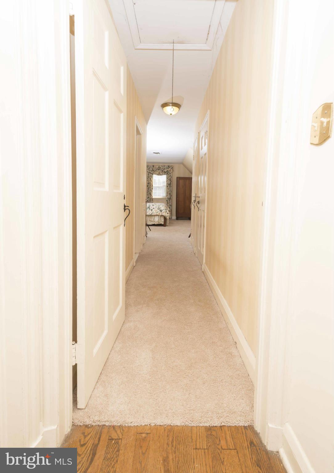 208 Taplow Road Baltimore, MD 21212 - Photo 18 of 30 a view of a hallway with a white walls