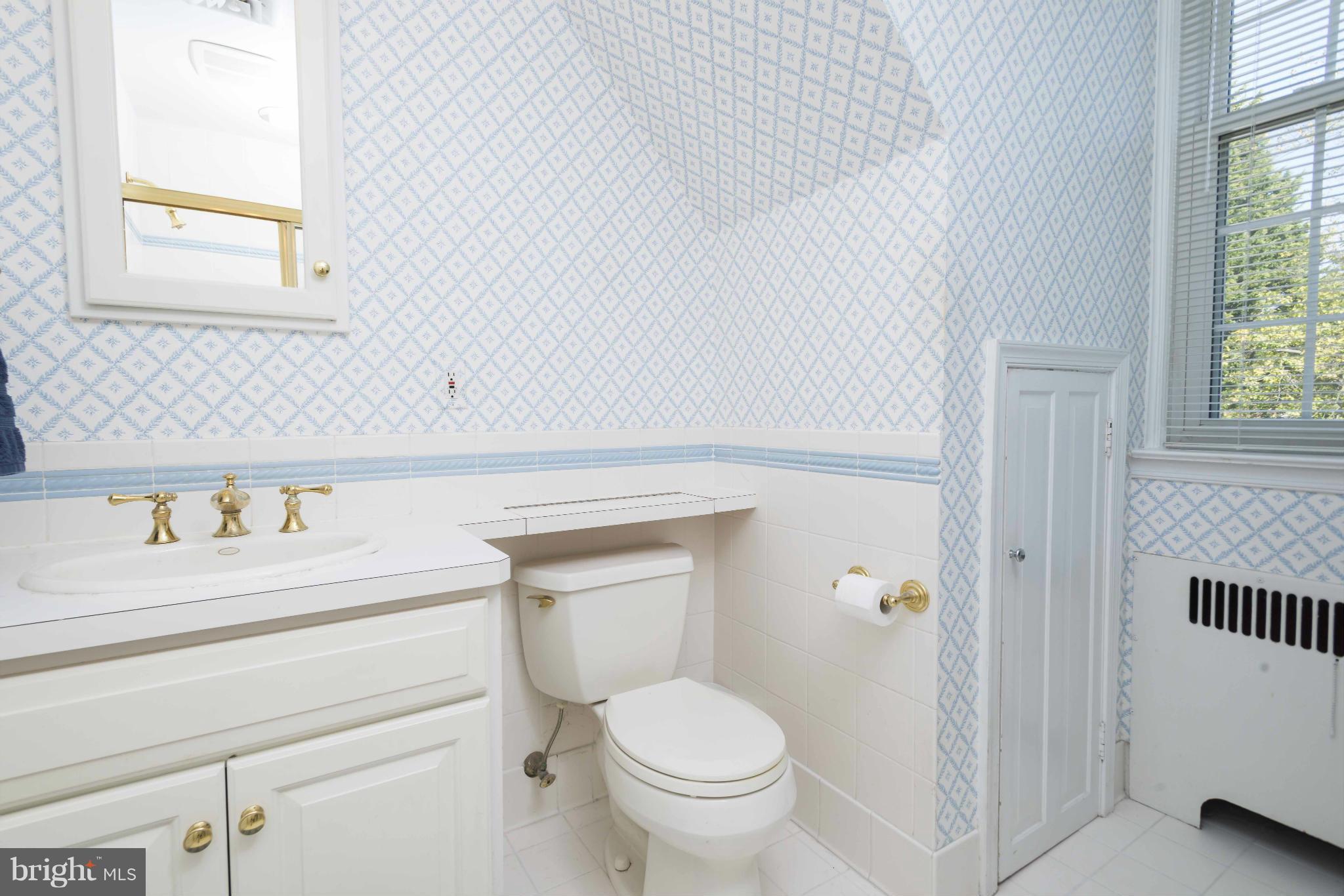 208 Taplow Road Baltimore, MD 21212 - Photo 19 of 30 a bathroom with a toilet and a sink