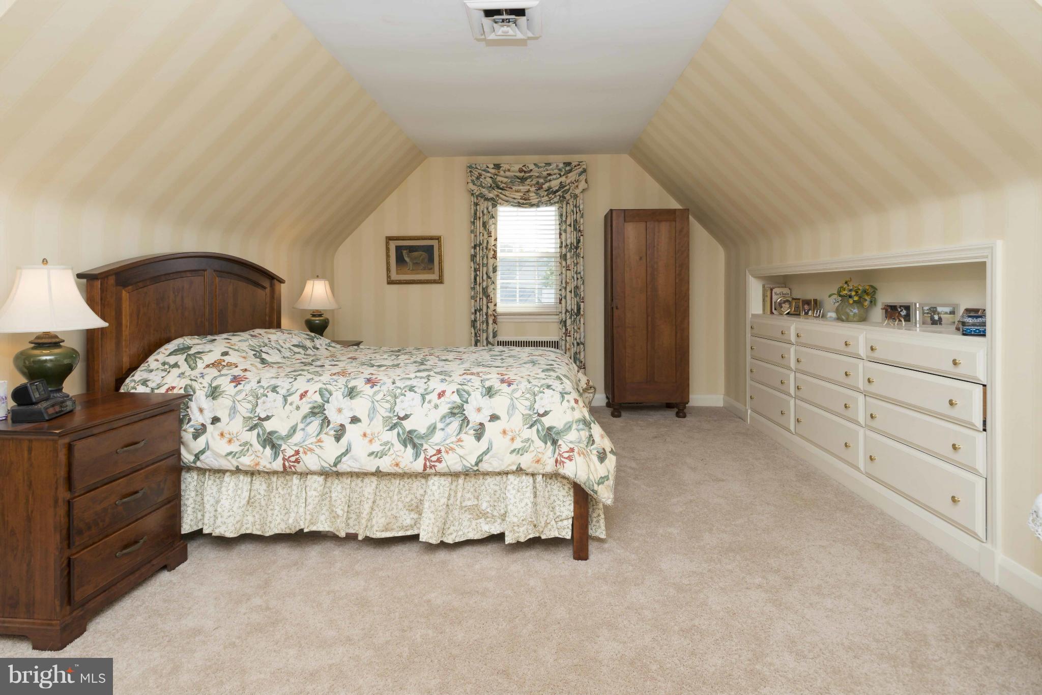 208 Taplow Road Baltimore, MD 21212 - Photo 20 of 30 a bedroom with a bed and a dresser