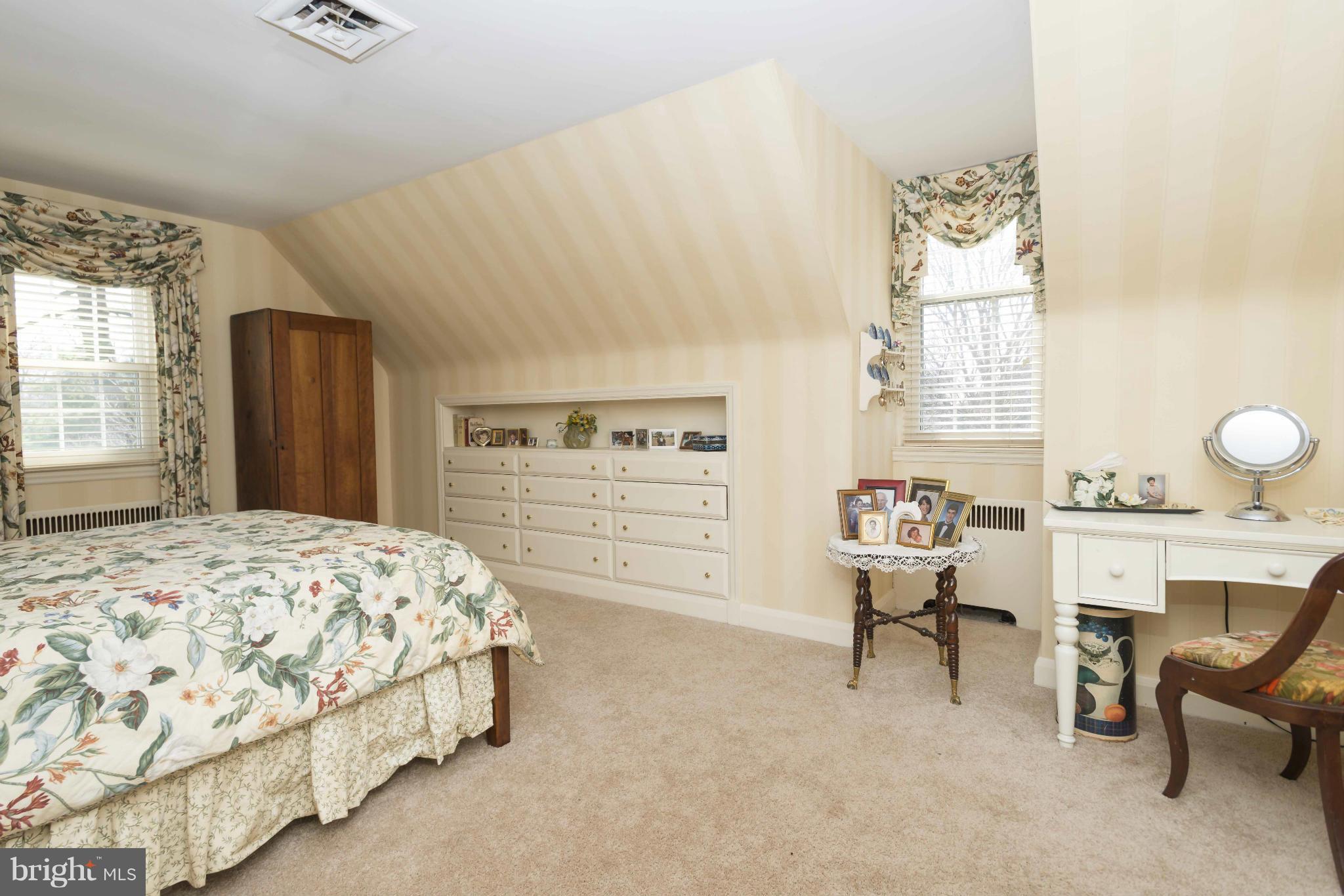 208 Taplow Road Baltimore, MD 21212 - Photo 21 of 30 a bedroom with a bed and a chair