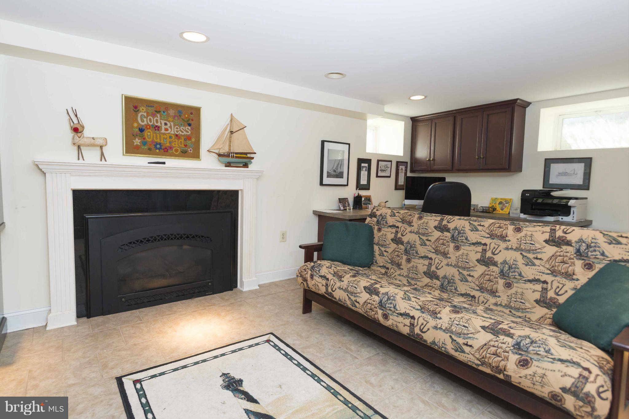 208 Taplow Road Baltimore, MD 21212 - Photo 23 of 30 a living room with furniture and a fireplace