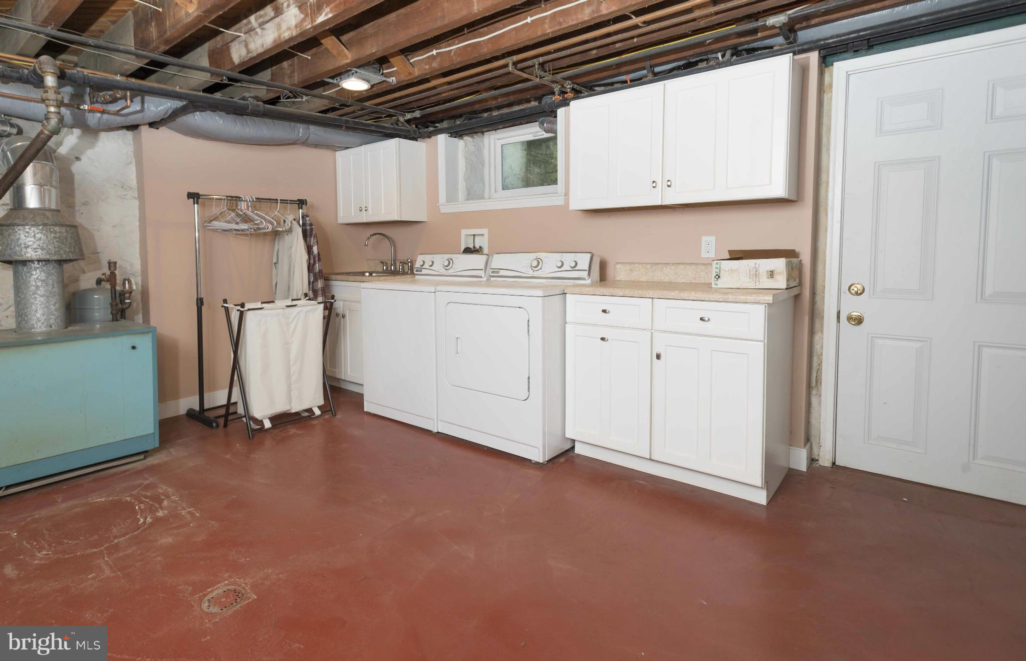 208 Taplow Road Baltimore, MD 21212 - Photo 25 of 30 a kitchen with white cabinets and white appliances