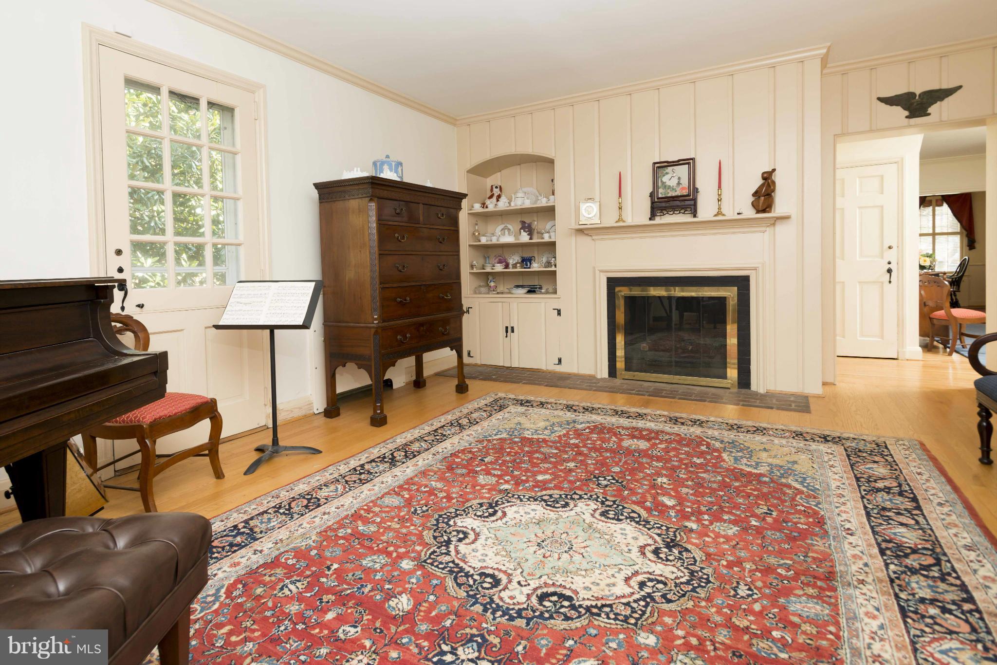 208 Taplow Road Baltimore, MD 21212 - Photo 5 of 30 a living room with furniture and a fireplace