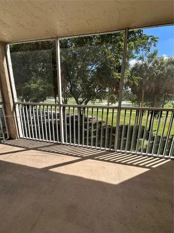 an aerial view of a house with outdoor space and lake view