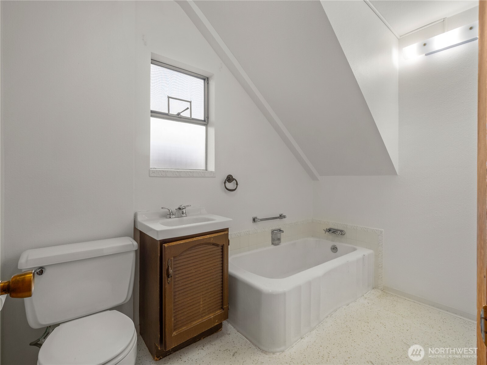 5704 North Ruby Street Tacoma, WA 98407 - Photo 16 of 38 a bathroom with a sink a toilet and a bathtub