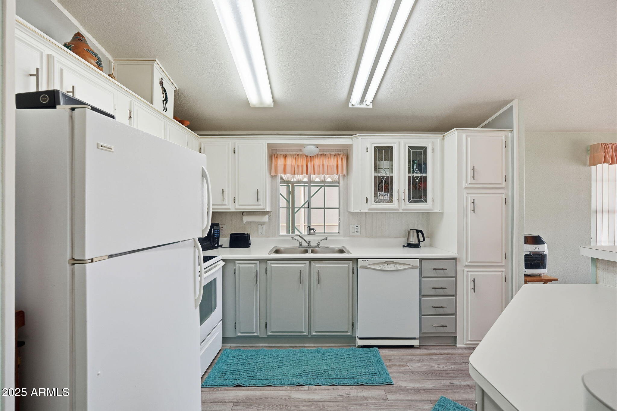 623 West Verde Lane Coolidge, AZ 85128 - Photo 11 of 34 a kitchen with stainless steel appliances a refrigerator sink and cabinets
