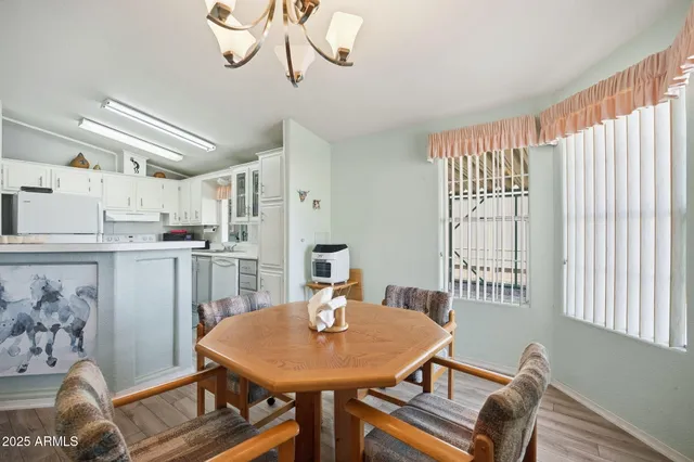 a dining room with furniture and window