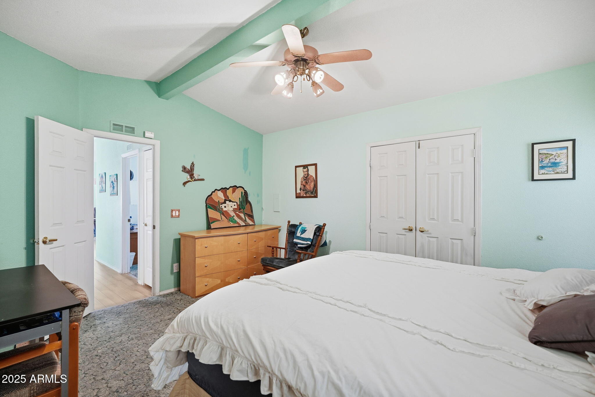 623 West Verde Lane Coolidge, AZ 85128 - Photo 19 of 34 a bedroom with a bed and a chandelier