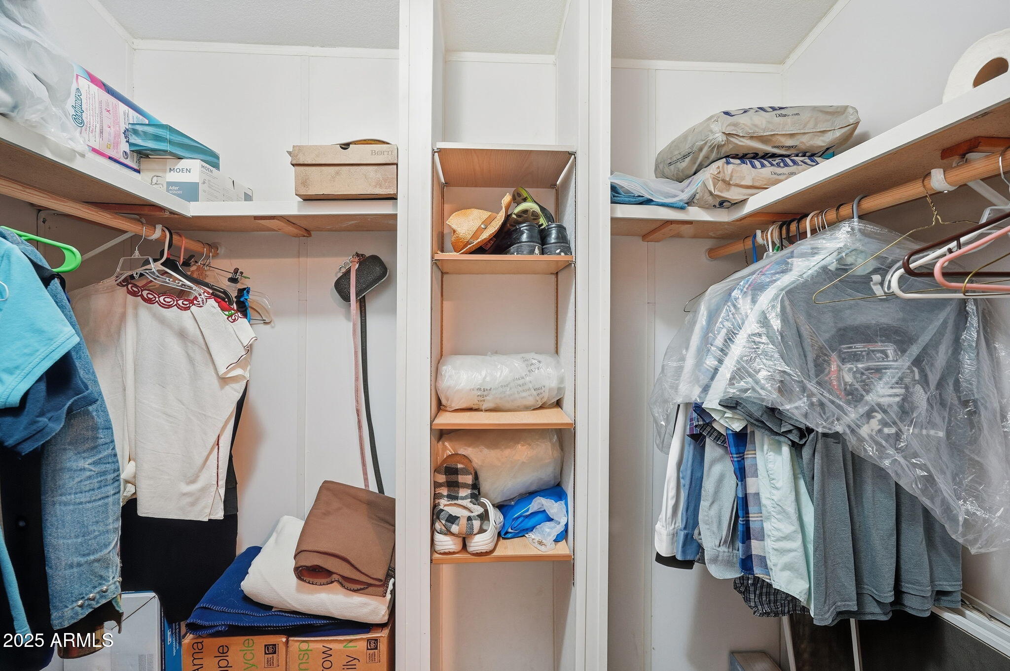 623 West Verde Lane Coolidge, AZ 85128 - Photo 20 of 34 a view of walk in closet with clothes and shoes