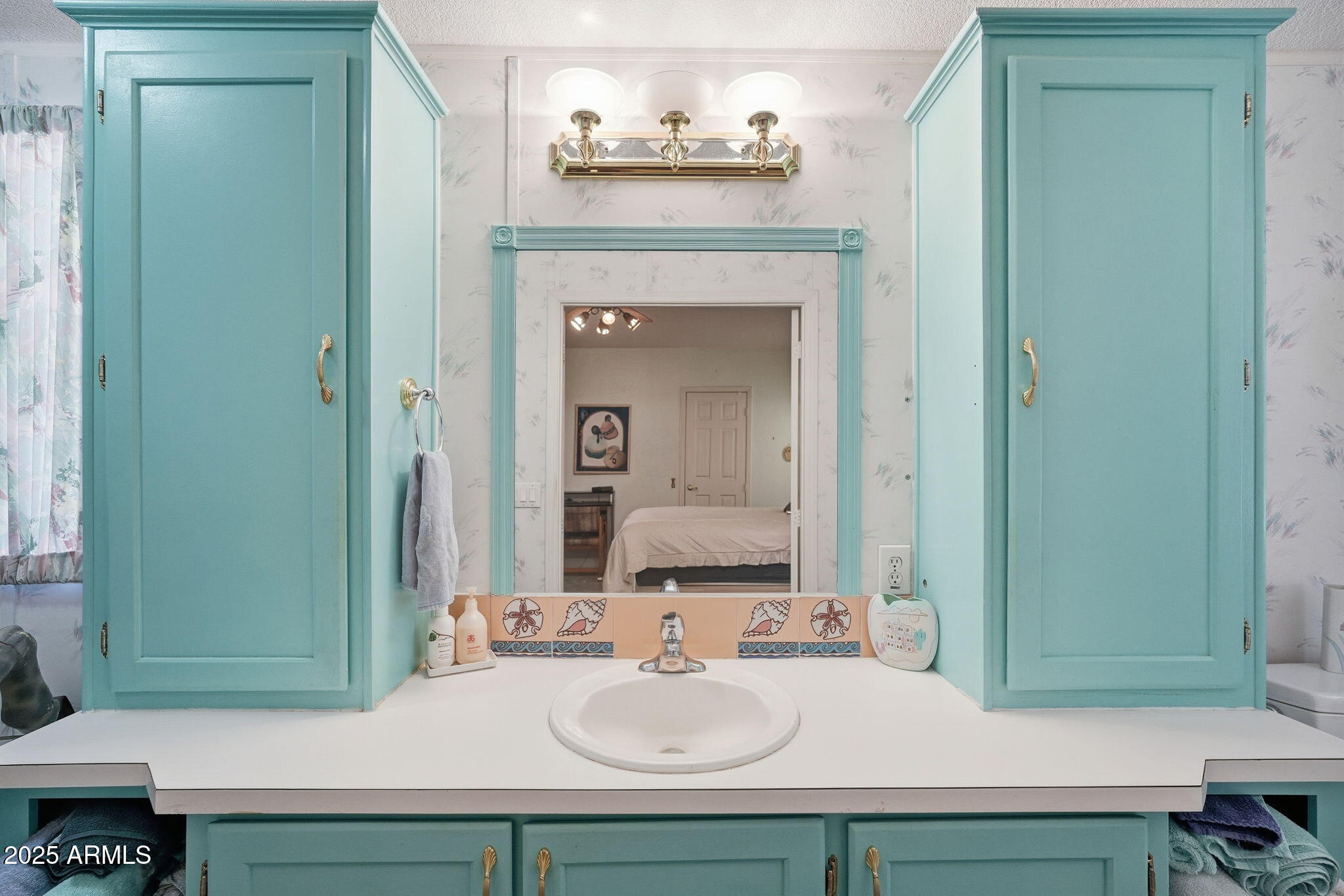 623 West Verde Lane Coolidge, AZ 85128 - Photo 21 of 34 a bathroom with a sink and a mirror