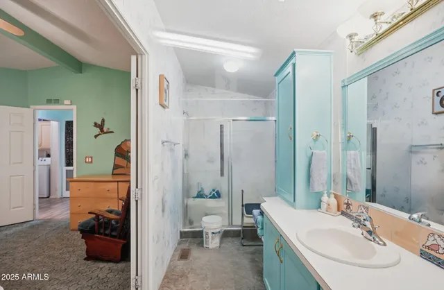 a bathroom with a sink and a mirror