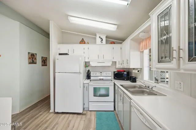 a living room with furniture a rug and a flat screen tv