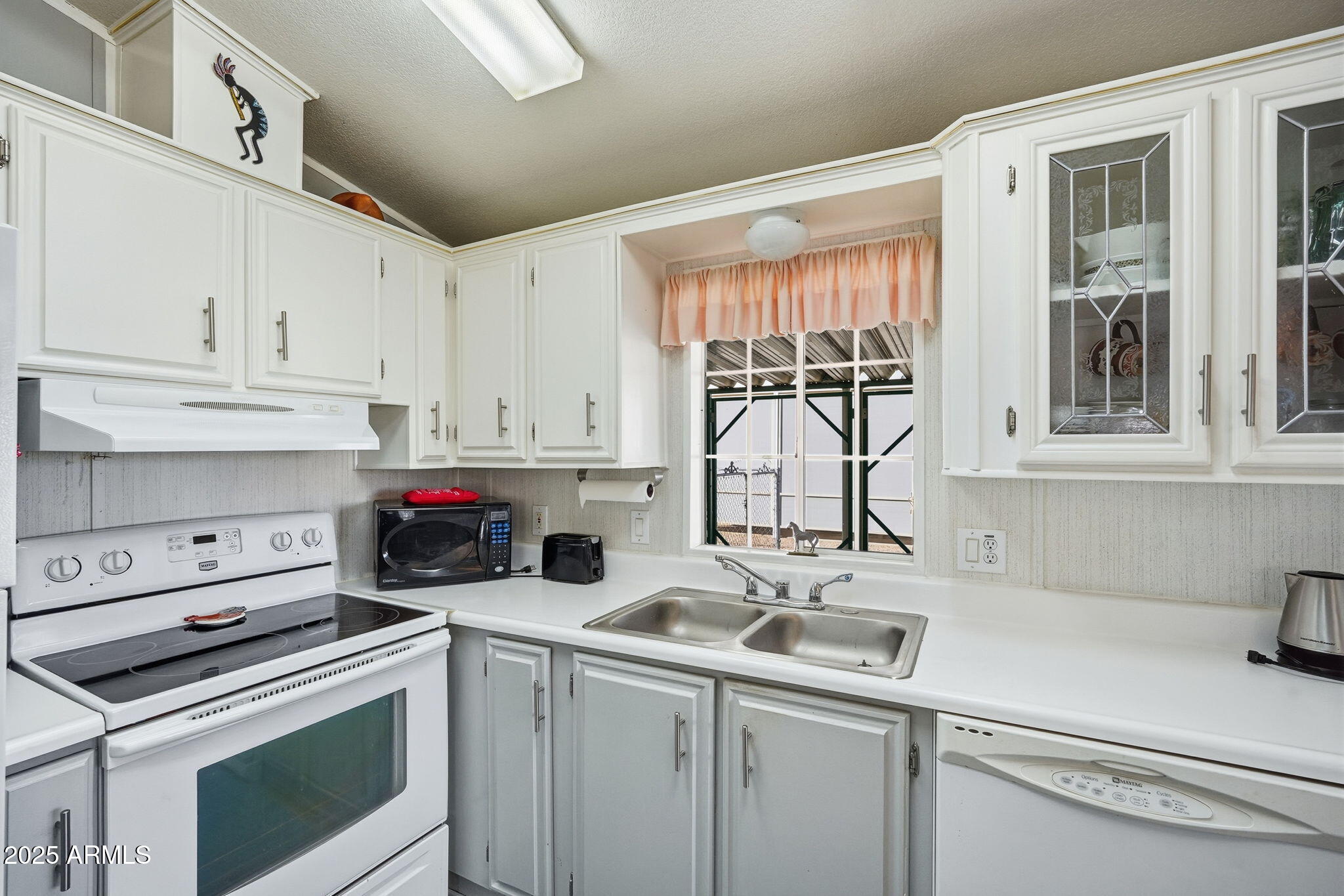 623 West Verde Lane Coolidge, AZ 85128 - Photo 9 of 34 a kitchen with a sink cabinets and window