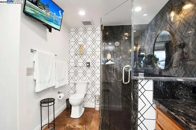 a bathroom with a bathtub and a shower