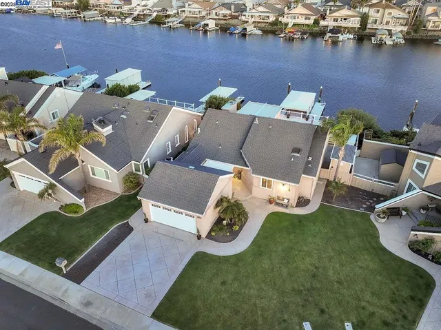 an aerial view of a house with outdoor space