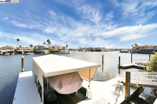 a terrace with outdoor seating and city view