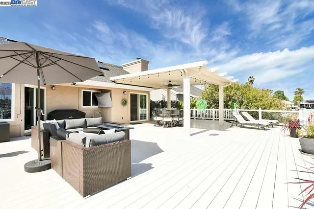 a view of a patio with couches chairs and a table