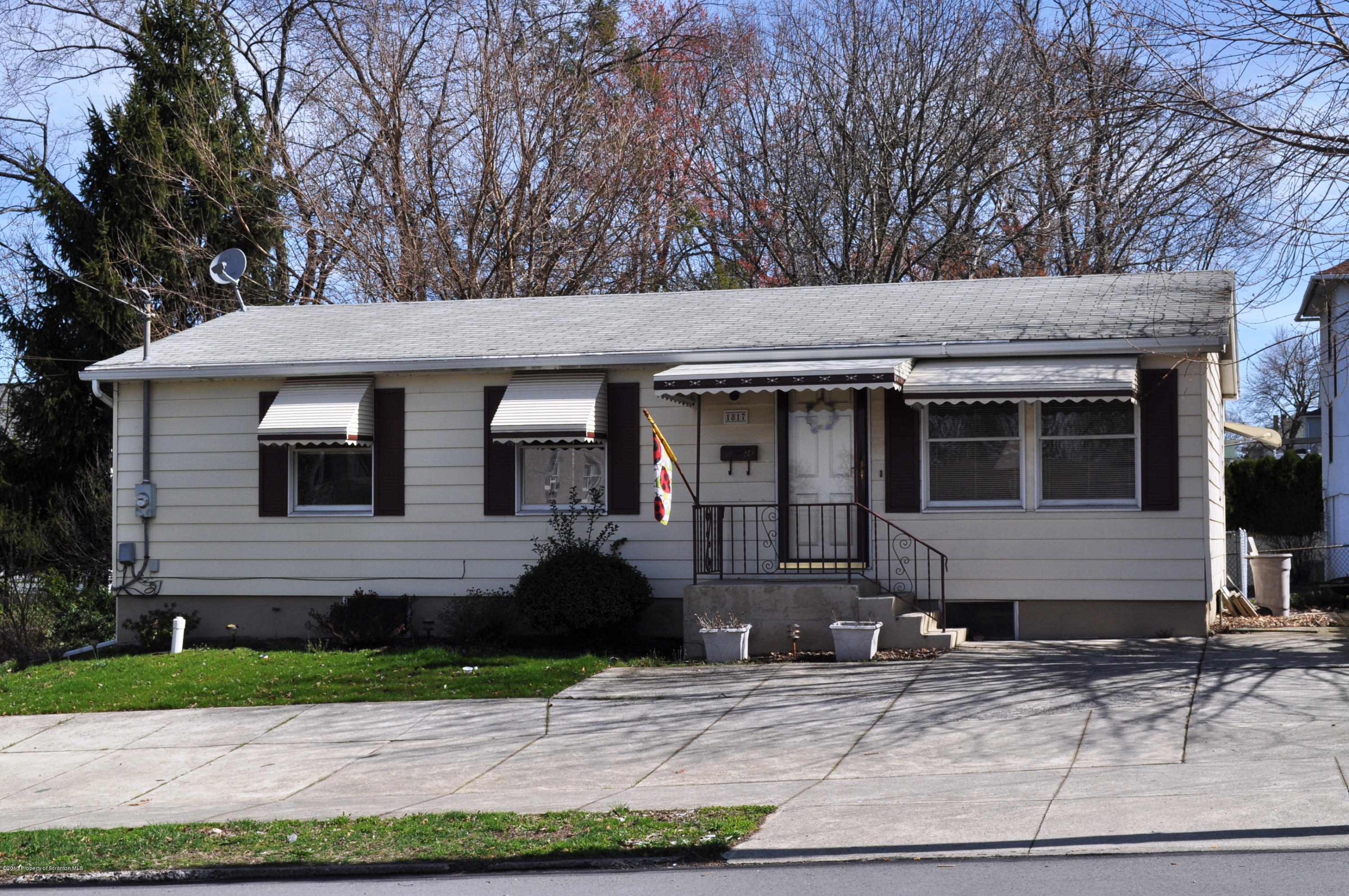1817 Green Ridge Street Dunmore, PA 18509 - Photo 1 of 21 a front view of a house with garden