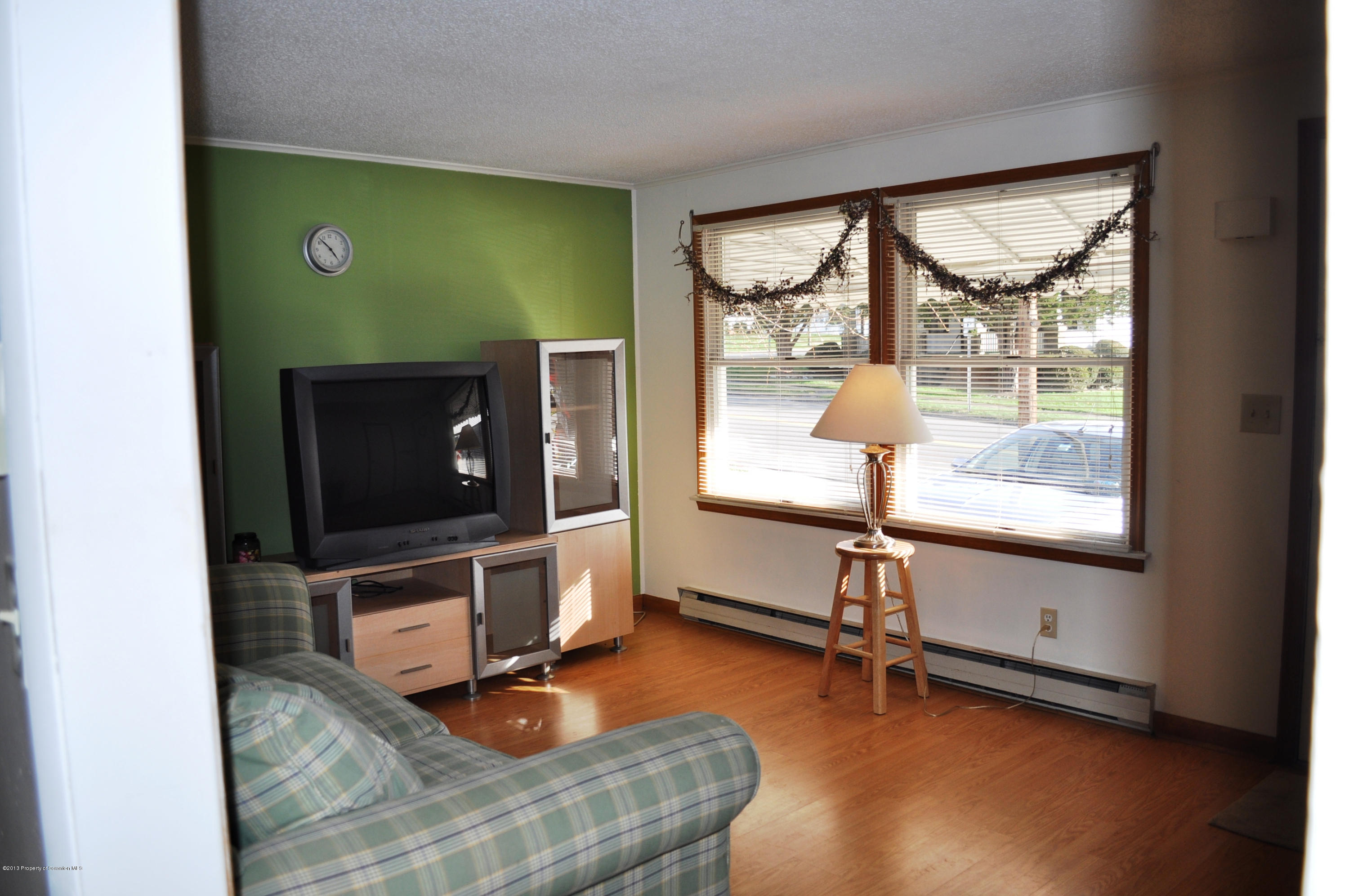 1817 Green Ridge Street Dunmore, PA 18509 - Photo 2 of 21 a room with gym equipment and a large window