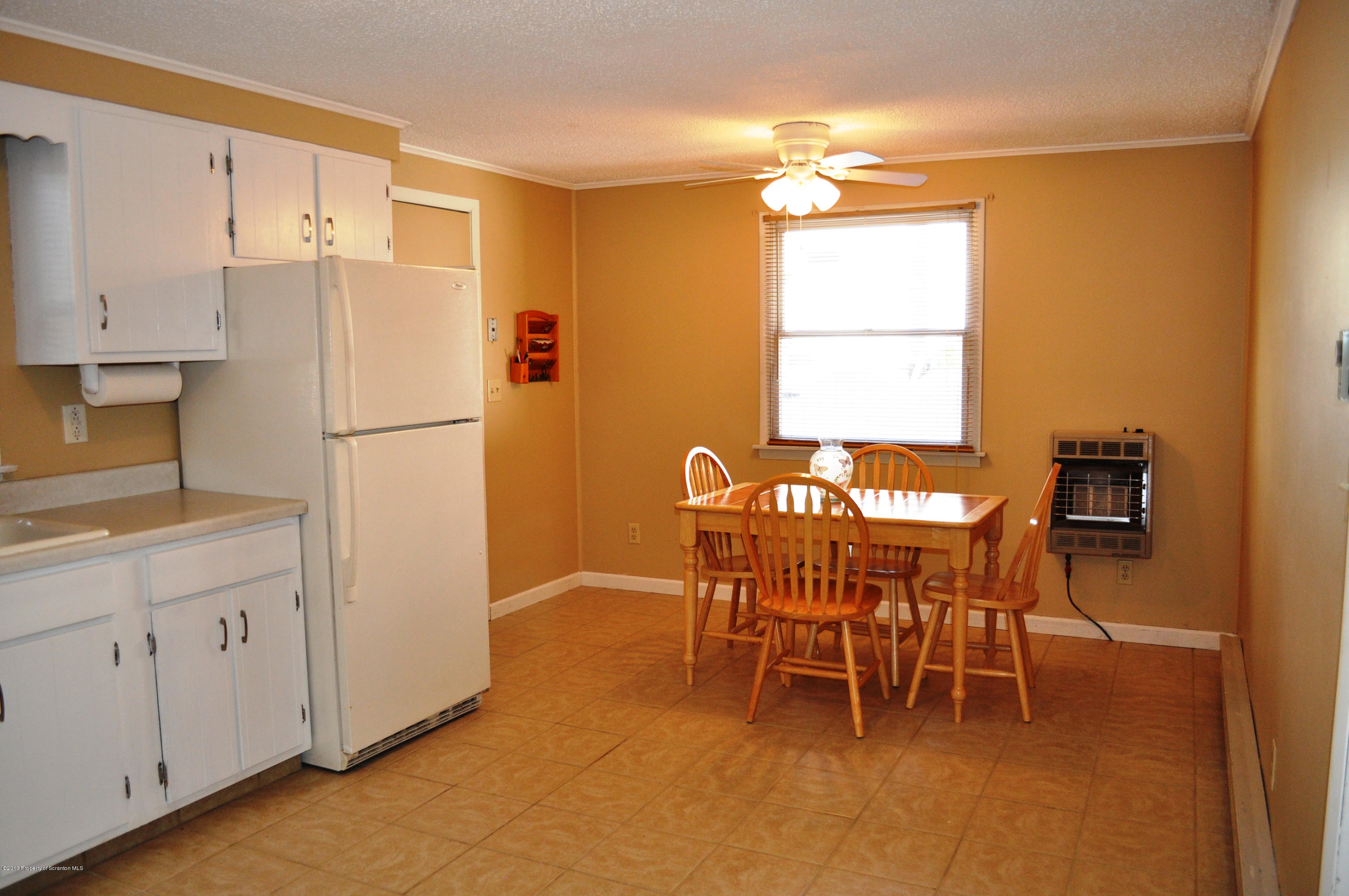1817 Green Ridge Street Dunmore, PA 18509 - Photo 5 of 21 a view of a dining room with furniture and a chandelier