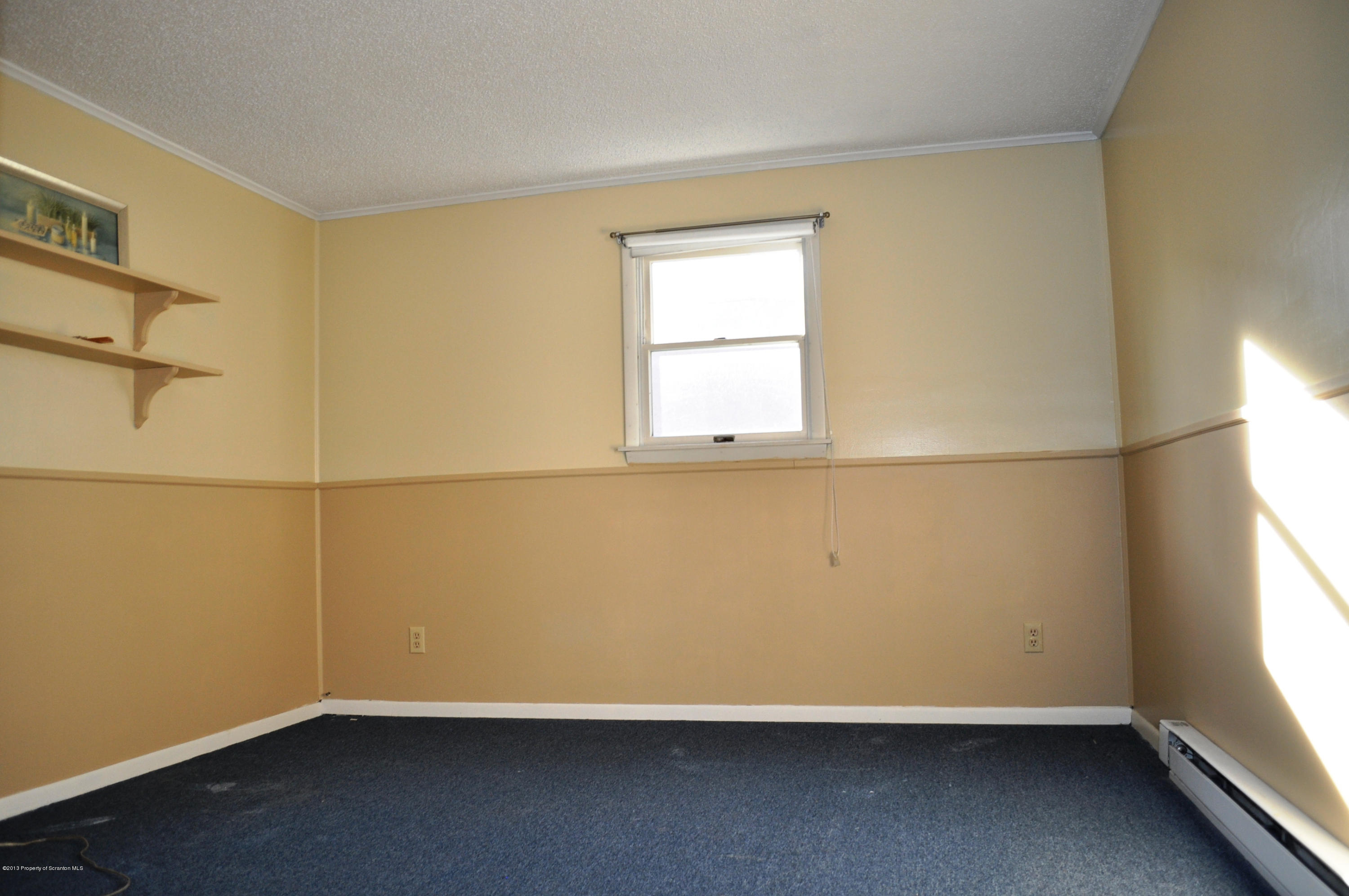 1817 Green Ridge Street Dunmore, PA 18509 - Photo 6 of 21 an empty room with a window