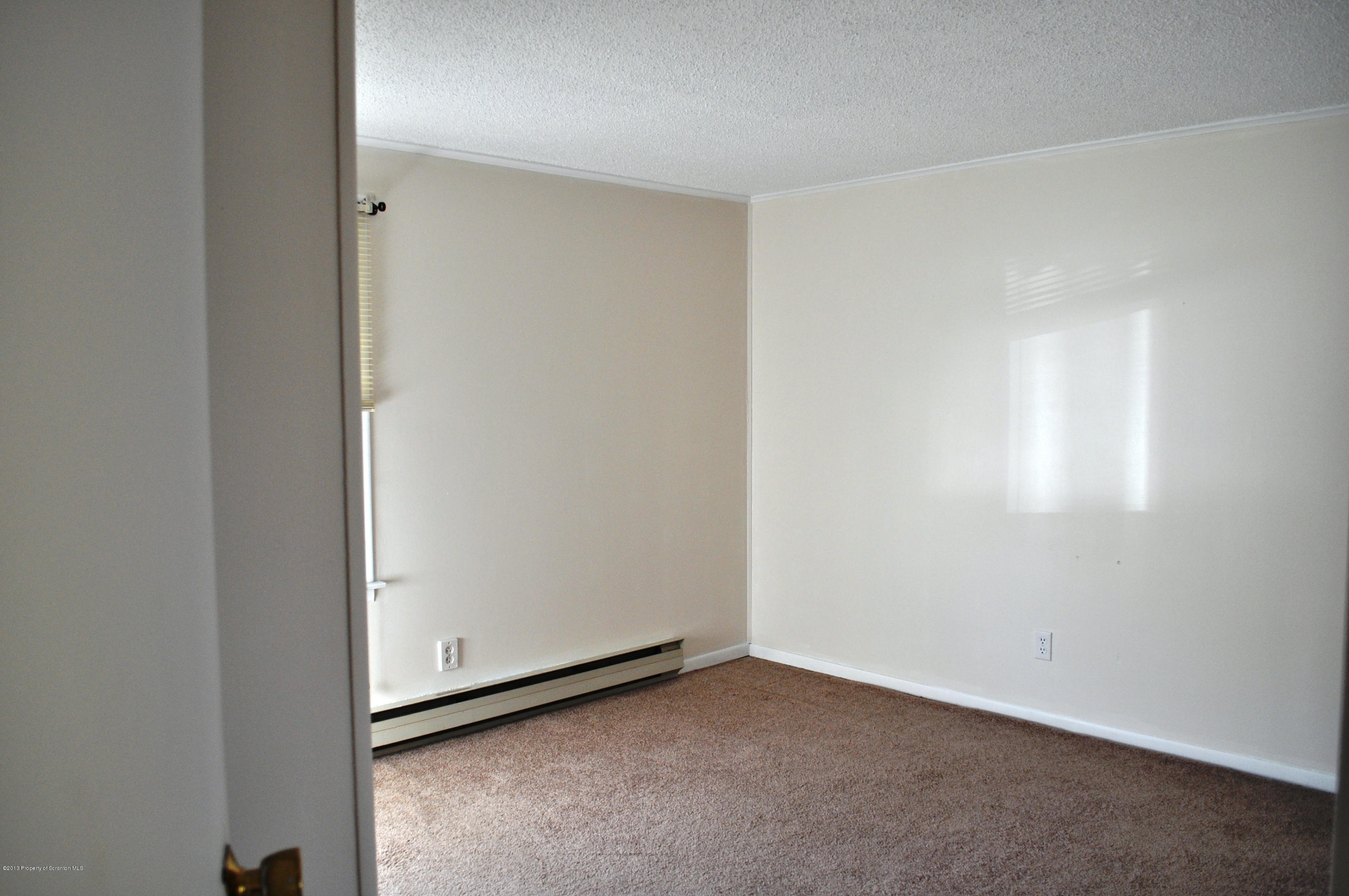1817 Green Ridge Street Dunmore, PA 18509 - Photo 7 of 21 a view of an empty room