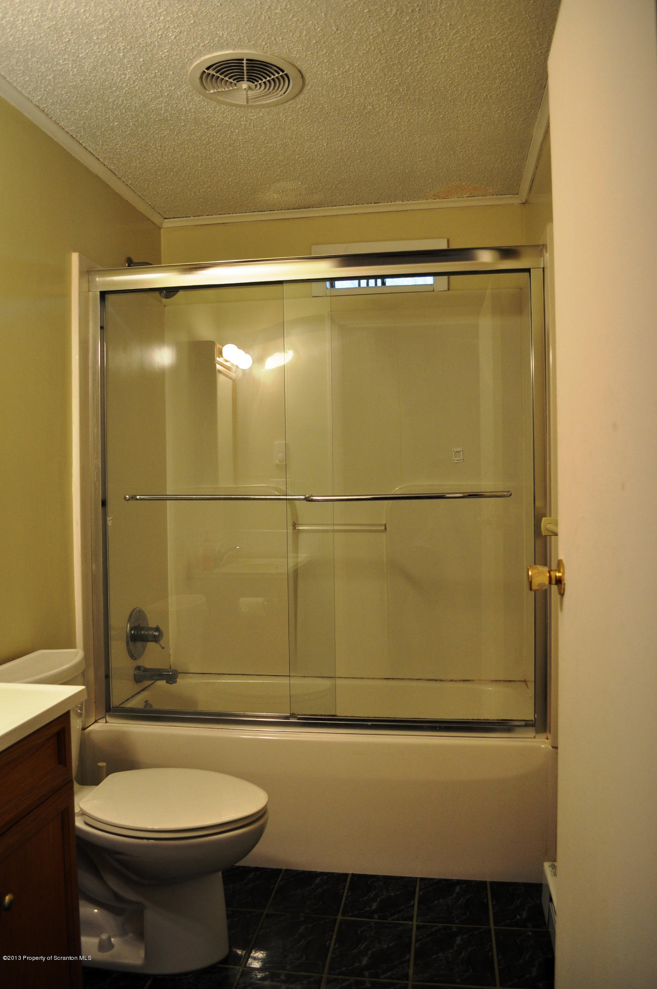 1817 Green Ridge Street Dunmore, PA 18509 - Photo 9 of 21 a bathroom with a toilet and a shower