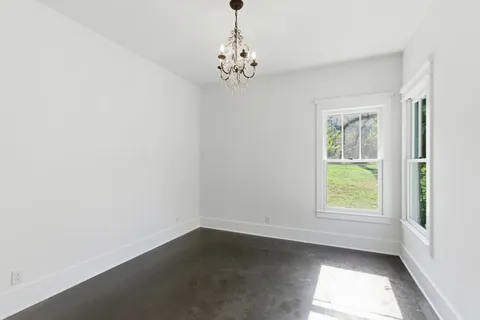 a bathroom with a bathtub and window