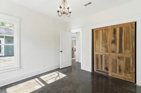a bathroom with a bathtub and a window